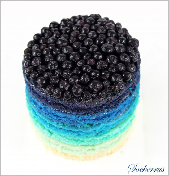 Blue Rainbow Cake, topped with blueberries