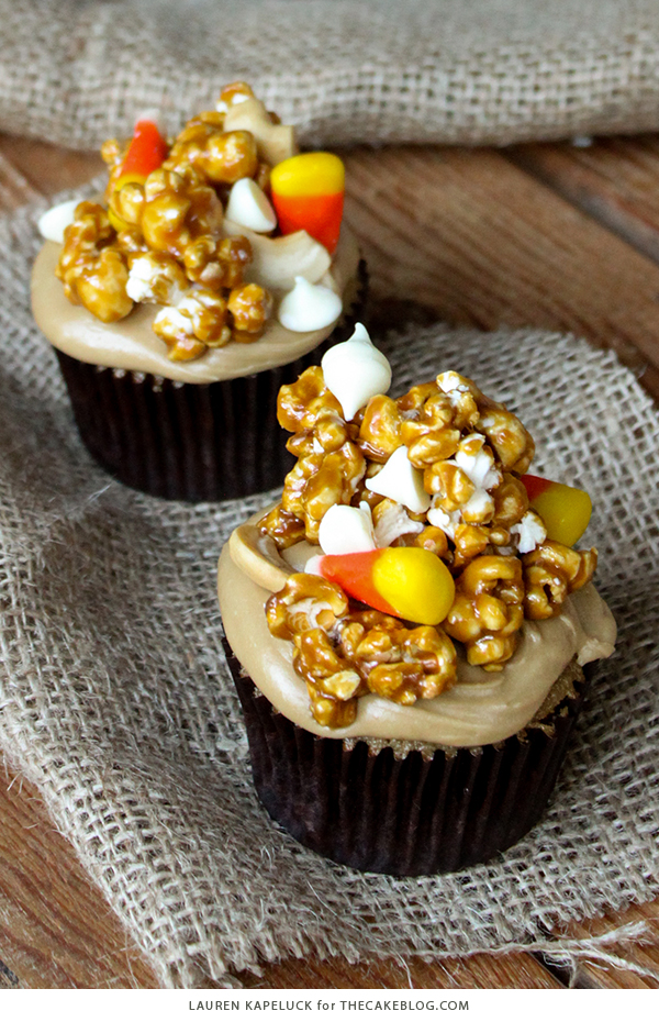 Caramel Corn Cupcakes for Halloween - caramel cupcakes topped with caramel frosting and caramel popcorn studded with candy corn and cashews | by Lauren Kapeluck for TheCakeBlog.com