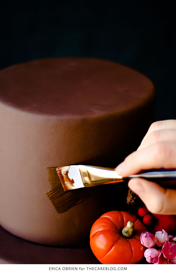 How to paint a cake with chocolate | Beautifully dark fall harvest cake with pumpkins, pears, pomegranates, eucalyptus and sage, perfect for Thanksgiving | Erica OBrien for TheCakeBlog.com