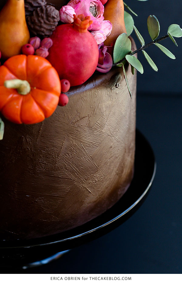 How to paint a cake with chocolate | Beautifully dark fall harvest cake with pumpkins, pears, pomegranates, eucalyptus and sage, perfect for Thanksgiving | Erica OBrien for TheCakeBlog.com