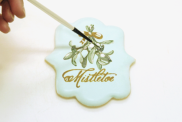 How to stencil-paint a cookie | Mistletoe Cookie Tutorial | by Robin Martin for TheCakeBlog.com