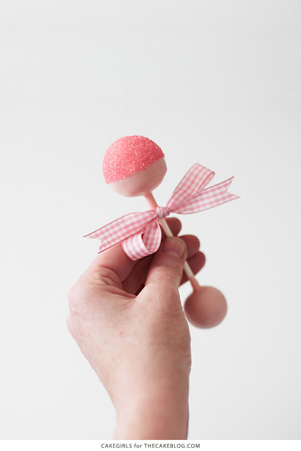 DIY Baby Rattle Cake Pops, perfect for baby showers | by Cakegirls for TheCakeBlog.com