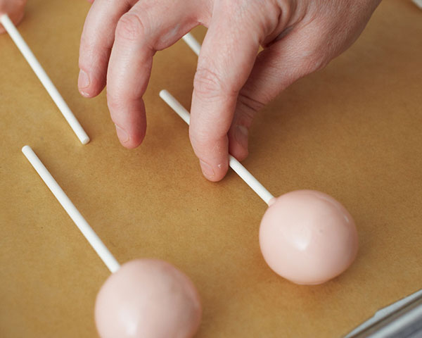 DIY Baby Rattle Cake Pops, perfect for baby showers | by Cakegirls for TheCakeBlog.com
