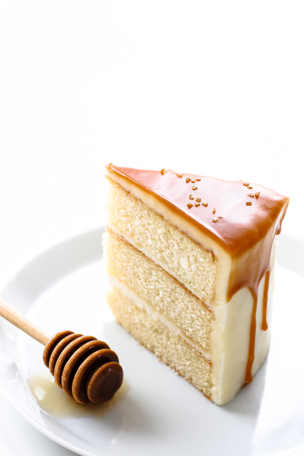 Honey Butter Cake | honey cake with honey cream cheese frosting topped with a honey butterscotch glaze | by Carrie Sellman for TheCakeBlog.com