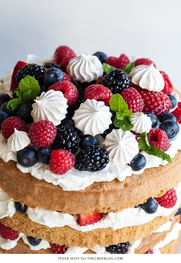 Eton Mess Cake - Inspired by the classic dessert, this cake combines crisp meringues, sweetened cream, fresh berries - layered between an airy sponge cake. | By Tessa Huff for TheCakeBlog.com