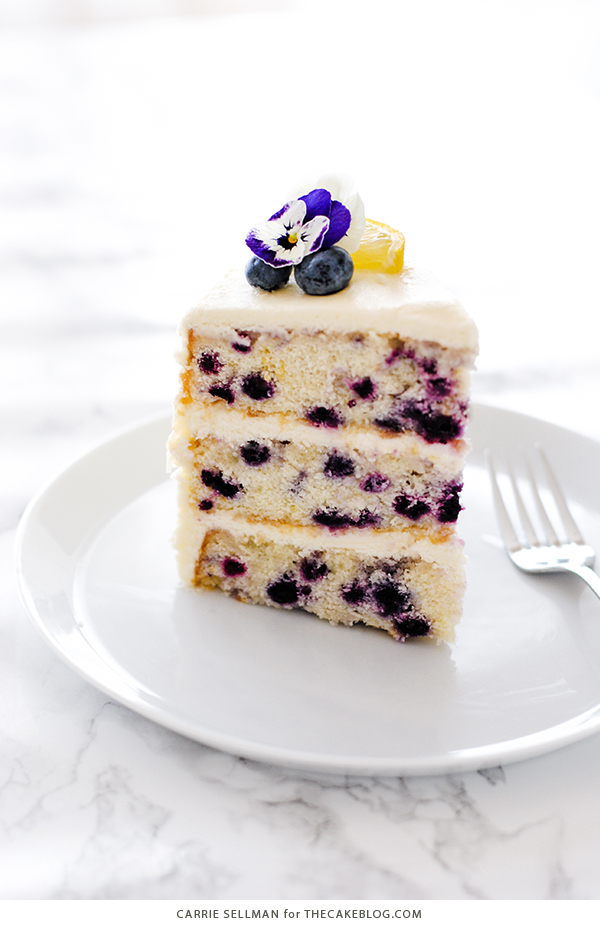 Lemon Blueberry Cake - lemon cake studded with wild blueberries, topped with lemon cream cheese frosting | by Carrie Sellman for TheCakeBlog.com