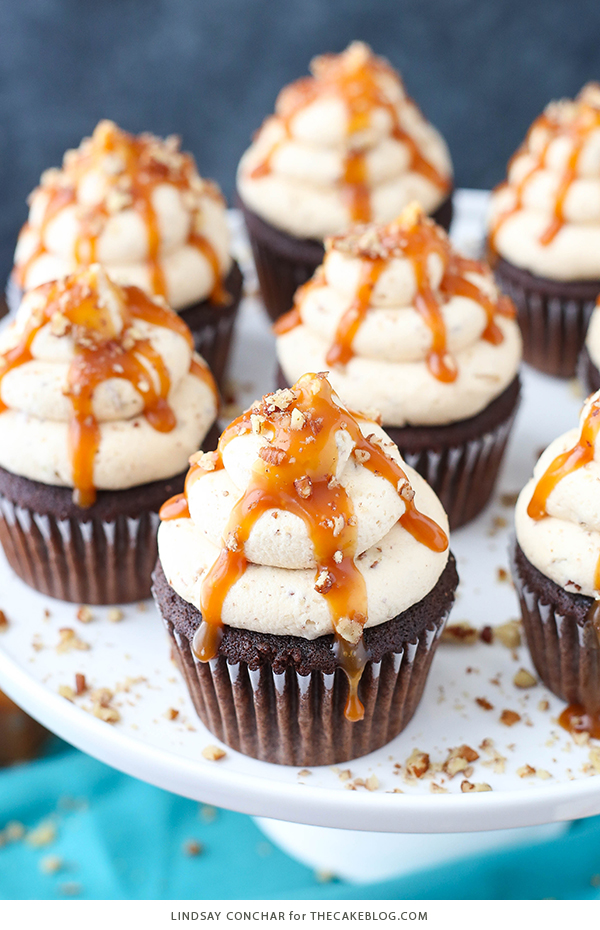 Chocolate Turtle Cupcakes - from scratch recipe for rich chocolate cupcakes with caramel pecan frosting, caramel drizzle and chopped pecans | by Lindsay Conchar for TheCakeBlog.com