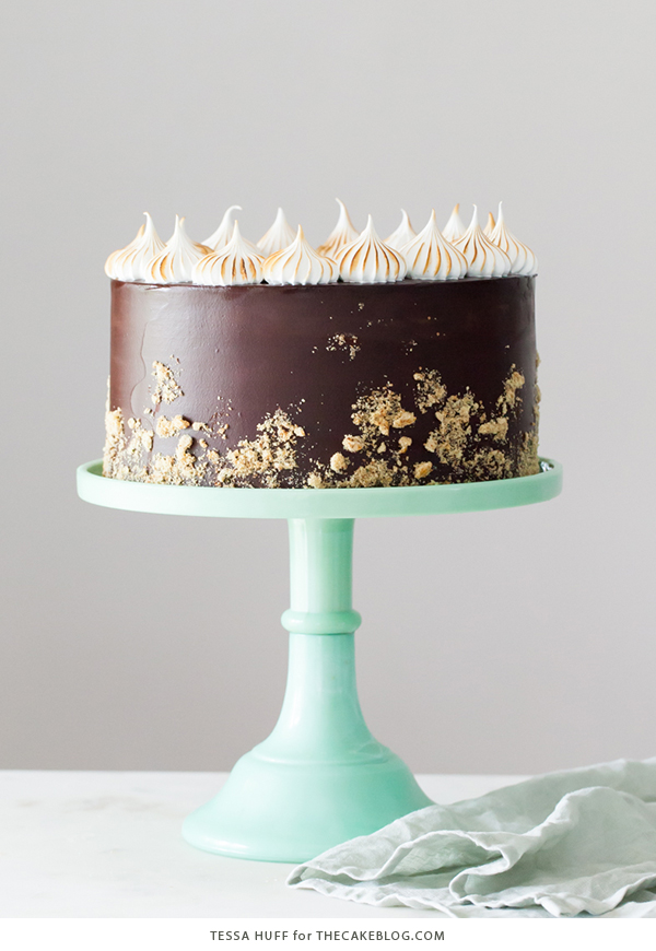 S'mores Cake - s'more inspired layer cake recipe with chocolate cake, graham cracker buttercream, chocolate ganache and toasted marshmallow meringue | by Tessa Huff for TheCakeBlog.com