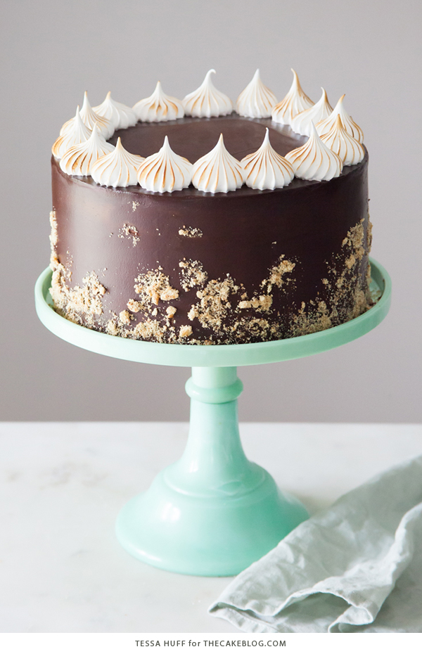 S'mores Cake - s'more inspired layer cake recipe with chocolate cake, graham cracker buttercream, chocolate ganache and toasted marshmallow meringue | by Tessa Huff for TheCakeBlog.com