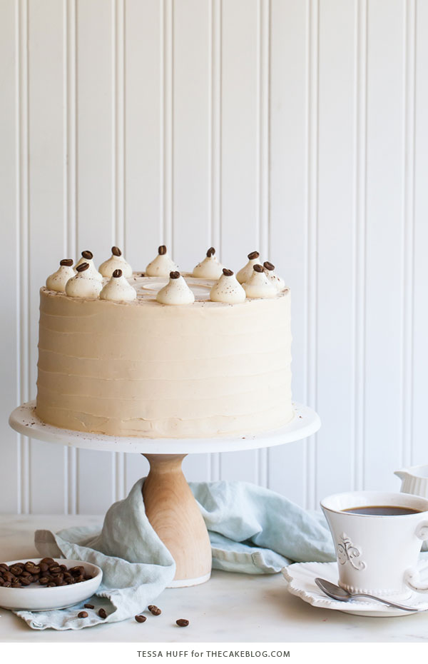 Caramel Cappuccino Cake - espresso cake paired with caramel buttercream frosting, topped with whole coffee beans and a sprinkle of cocoa powder | by Tessa Huff for TheCakeBlog.com