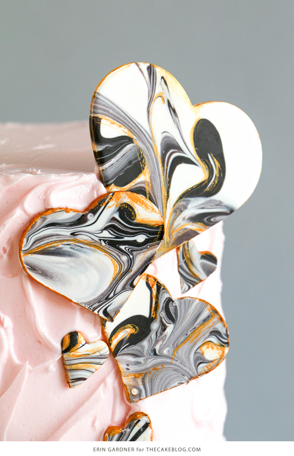 Marble Chocolate Hearts - how to make marbled heart toppers for cakes and cupcakes using chocolate coating and cookie cutters | by Erin Gardner for TheCakeBlog.com
