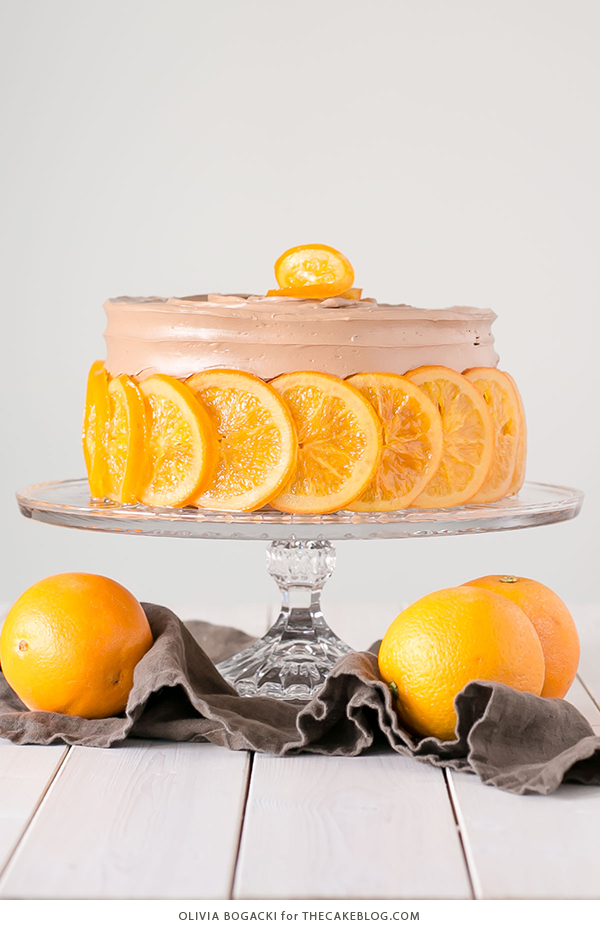 Chocolate Orange Cake - layer cake infused with orange zest and orange syrup, topped with chocolate frosting and candied orange slices | By Olivia Bogacki for TheCakeBlog.com
