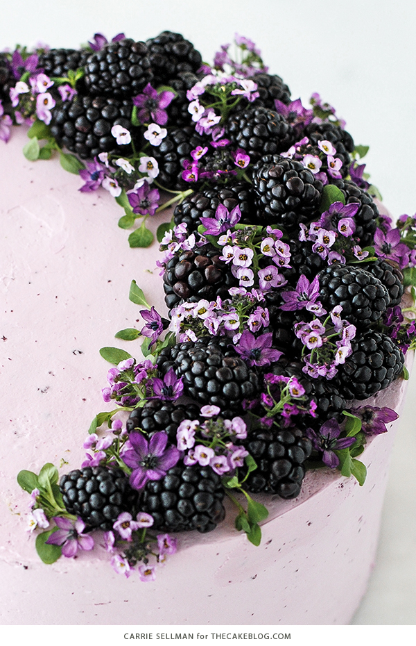 Blackberry Lime Cake - tender cake infused with lime zest, frosted with blackberry buttercream, topped with fresh blackberries and edible flowers | by Carrie Sellman for TheCakeBlog.com