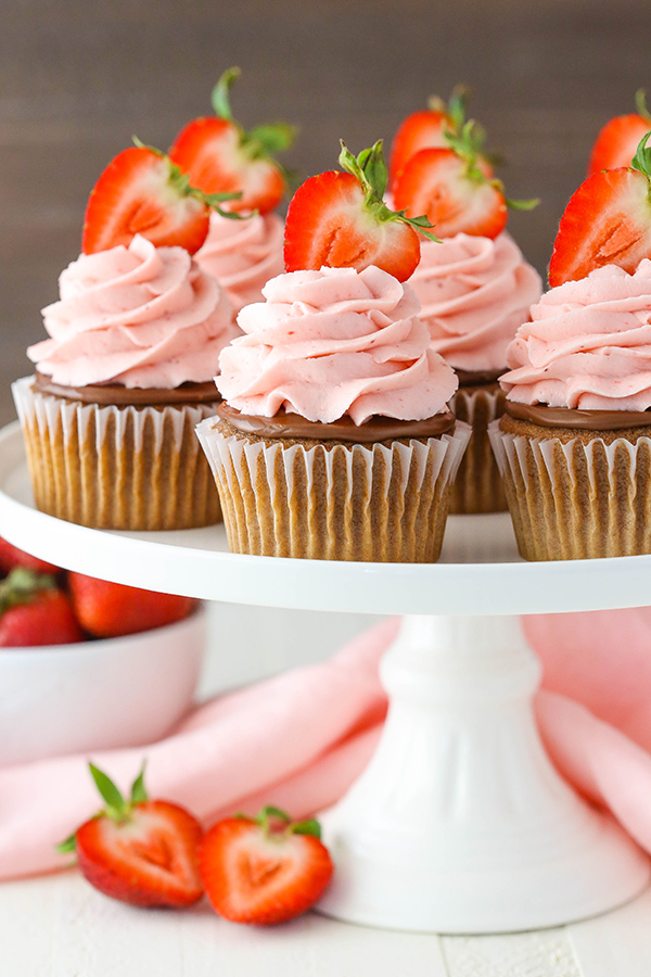 Strawberry Nutella Cupcakes with a soft, fluffy Nutella cupcake topped with more Nutella and a fresh strawberry frosting | by Lindsay Conchar for TheCakeBlog.com