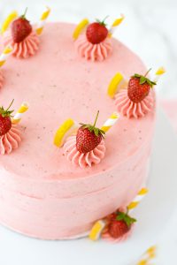 Strawberry Lemonade Cake - tender lemon cake paired with fresh strawberry buttercream | by Carrie Sellman for TheCakeBlog.com