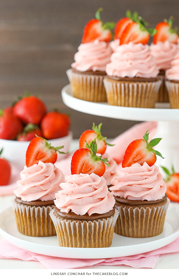 Strawberry Nutella Cupcakes with a soft, fluffy Nutella cupcake topped with more Nutella and a fresh strawberry frosting | by Lindsay Conchar for TheCakeBlog.com