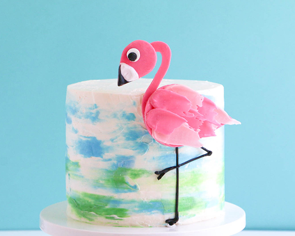 Flamingo Cake - how to make a pink flamingo cake topper using chocolate candy melts and brushstroke feathers | by Erin Gardner for TheCakeBlog.com