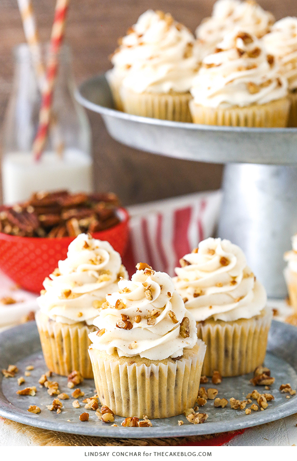 Butter Pecan Cupcakes - moist vanilla cupcakes studded with toasted butter pecans and topped with cinnamon buttercream frosting | by Lindsay Conchar for TheCakeBlog.com