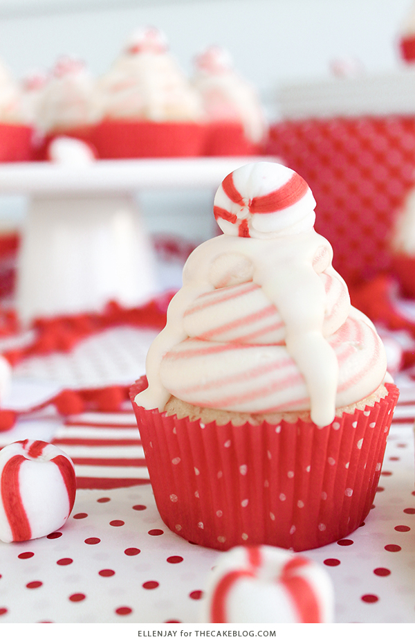 White Chocolate Peppermint Cupcakes - delicious white cake speckled with candy canes, topped with red and white swirled buttercream and white chocolate ganache | by ellenJAY for TheCakeBlog.com