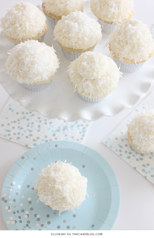 Coconut Cupcakes - fluffy coconut cupcakes made with coconut milk and topped with smooth coconut buttercream and coconut flakes | by ellenJAY for TheCakeBlog.com