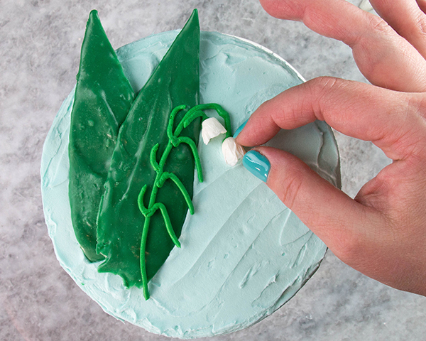 Chocolate Lilies - how to make Lily of the Valley cake decorations with chocolate | by Erin Gardner for TheCakeBlog.com