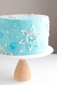 Sueded Buttercream Cake with Sprinkle Snowflakes | by Erin Gardner for TheCakeBlog.com