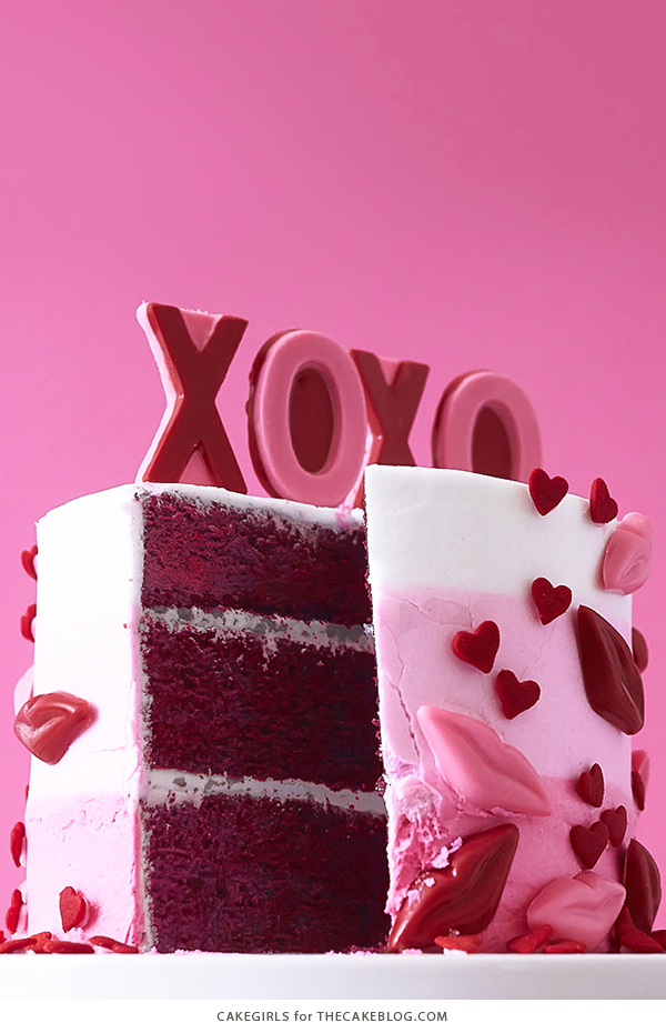 XOXO Valentine's Day Cake - how to make a pink ombre striped cake decorated with chocolate lips, hearts and an XOXO topper | by Cakegirls for TheCakeBlog.com