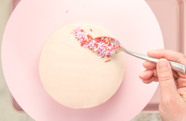 Sprinkle Girl Cake - how to make cute girly face cakes with sprinkles for the hair and chocolate heart sunglasses | by Erin Gardner for TheCakeBlog.com